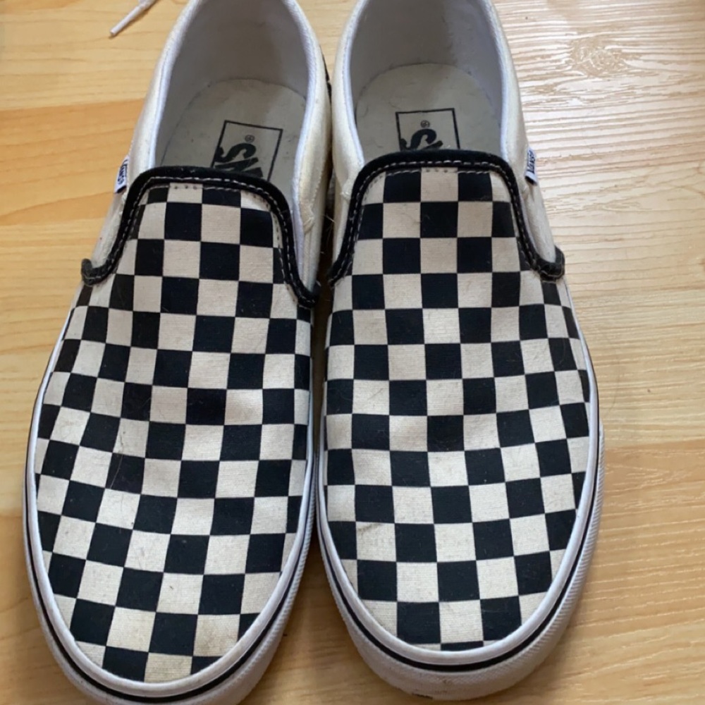 Black checkered slip on vans